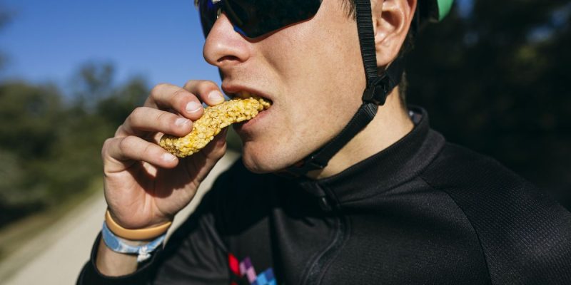 portrait-of-cyclist-eating-a-snack-during-a-break-royalty-free-image-1597088948